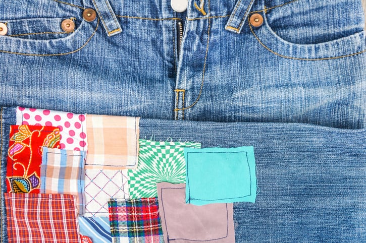 Patchwork on jeans background