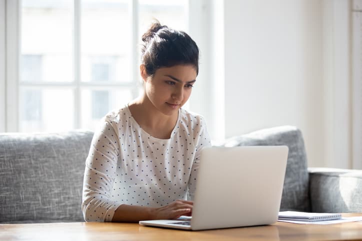 Women typing on a laptop