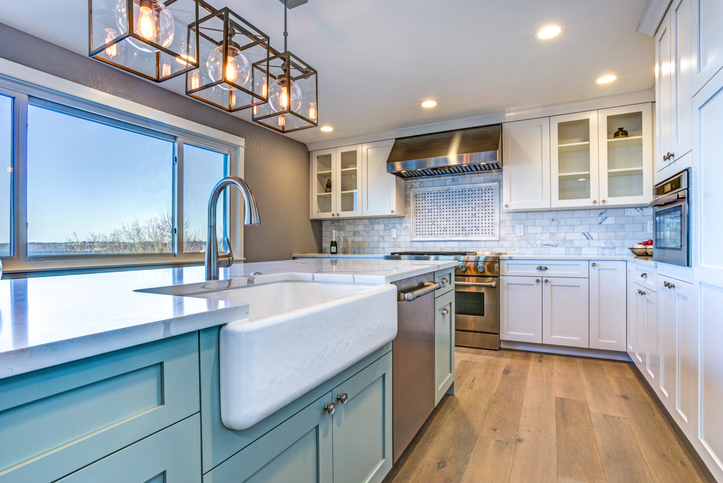 Beautiful kitchen room with green island and farmhouse sink. | farmhouse chic decor