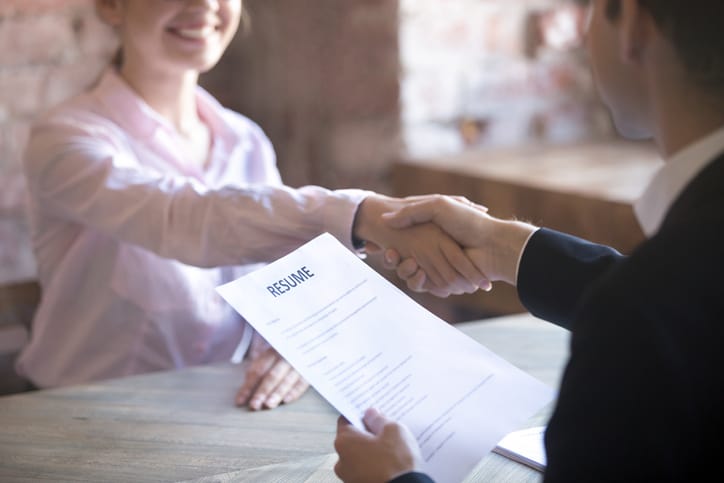Goodwill AZ | women holding a resume and shaking hands