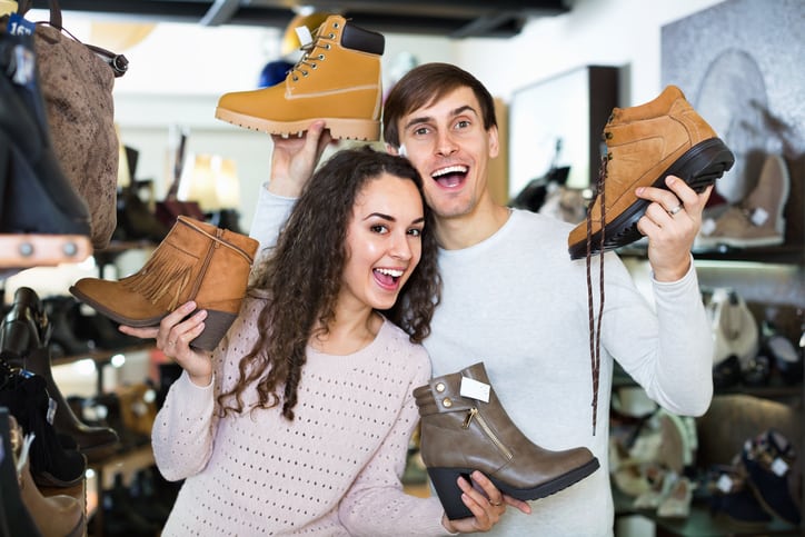 Goodwill AZ | couple holding four different shoes