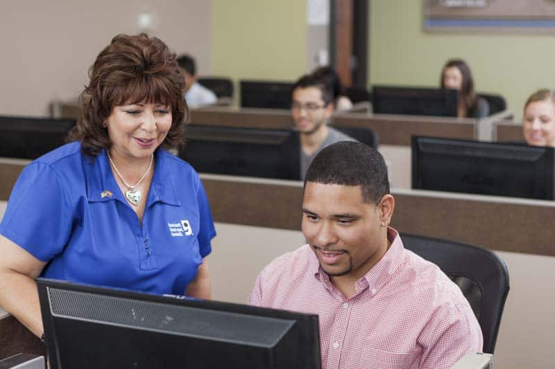 Goodwill AZ | Women and man looking at a computer