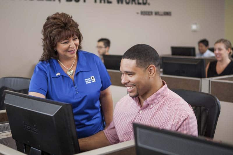 Goodwill AZ | Women and men looking at a computer