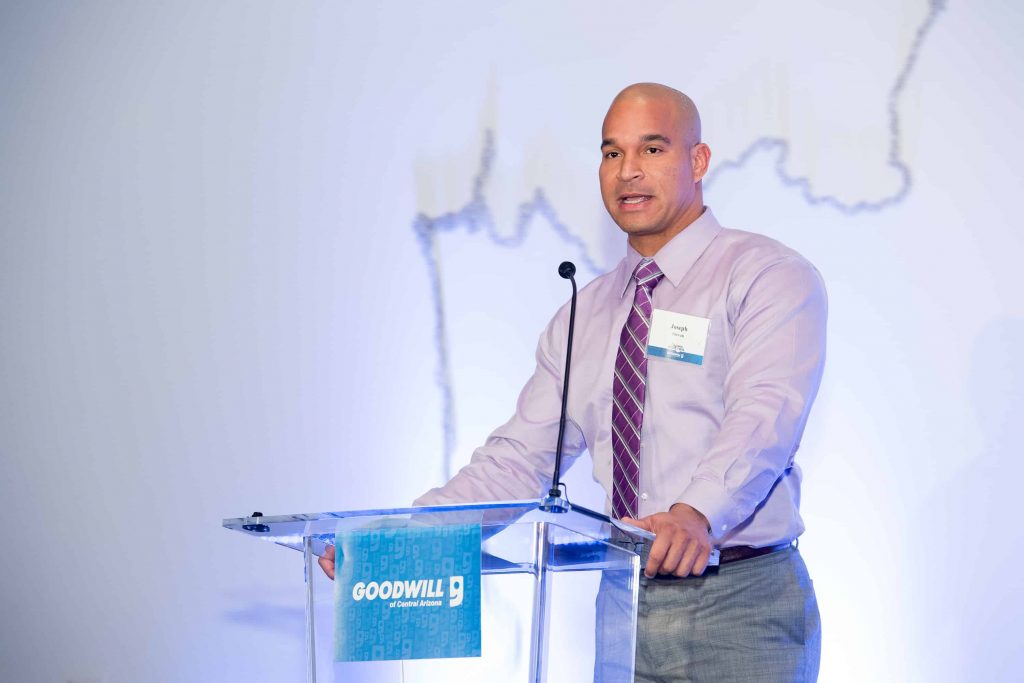 Goodwill AZ | Man giving a speech at a podium