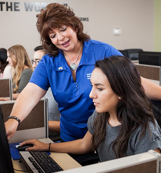 Goodwill AZ | Women teaching on a computer