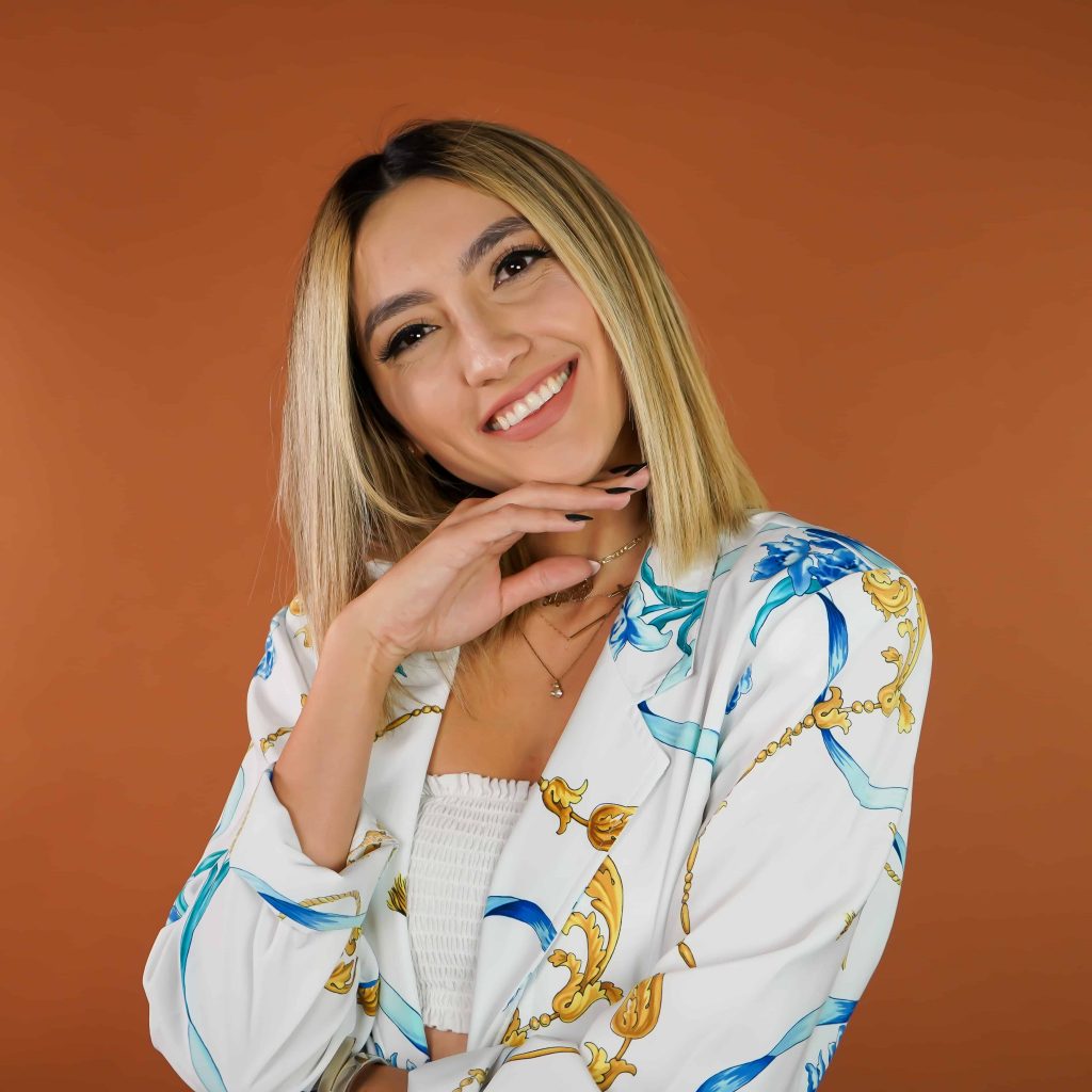 Goodwill AZ | women in blue and gold floral shirt