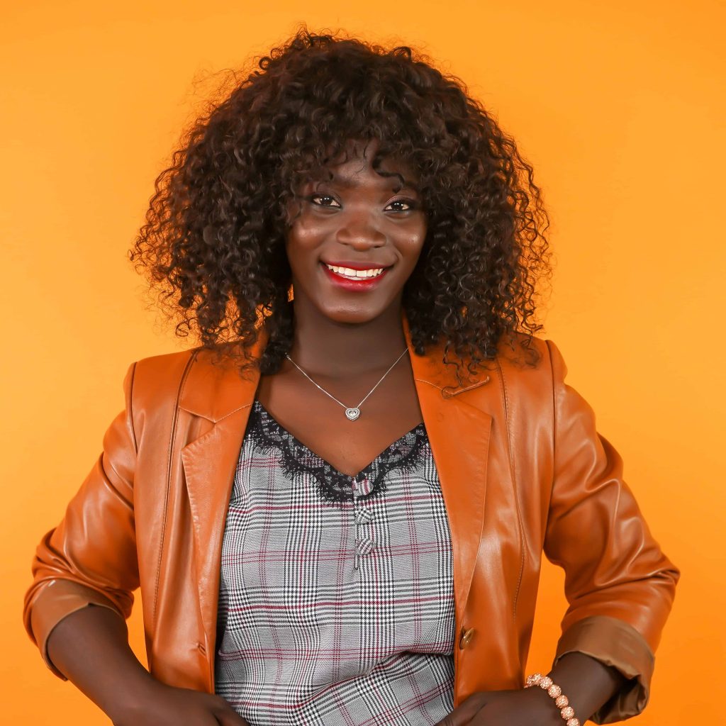 Goodwill AZ | Women in orange blazer