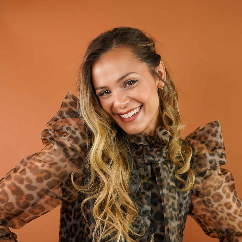 Goodwill AZ | Women in animal print shirt