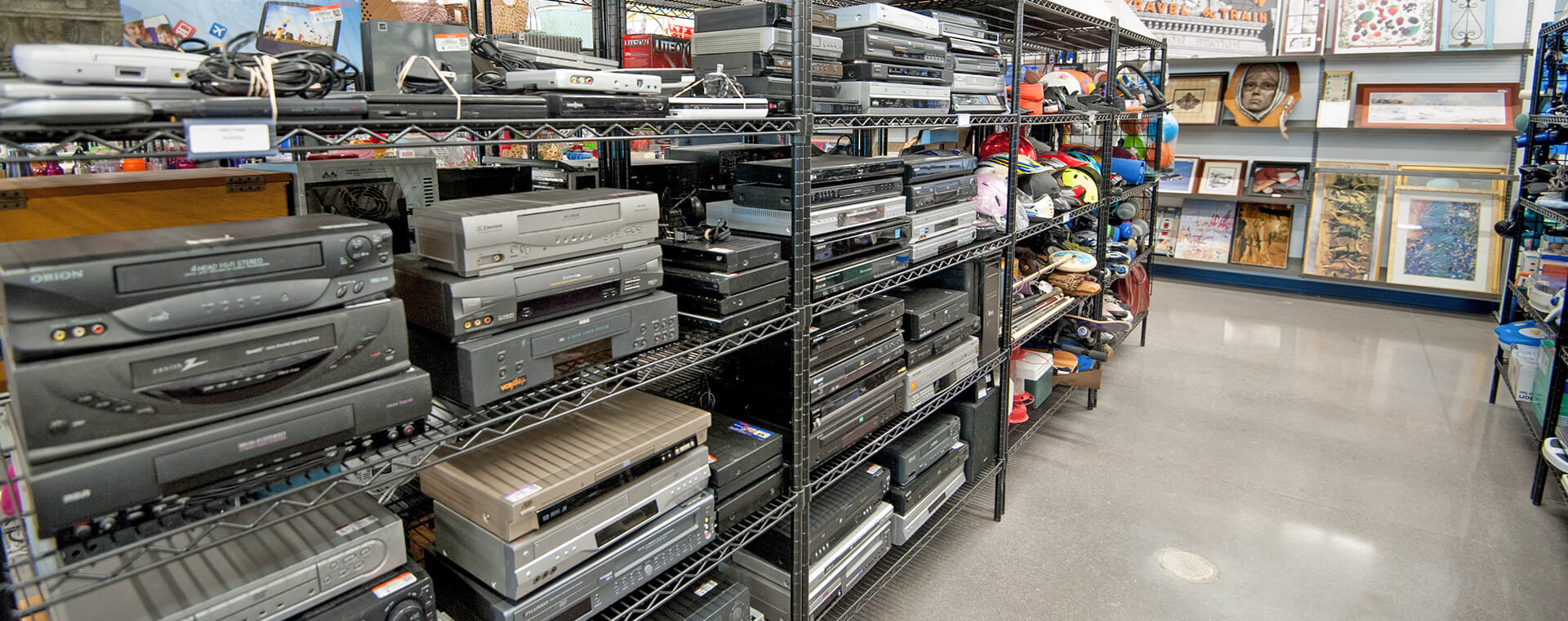 Goodwill AZ | Racks of DVD players in a store