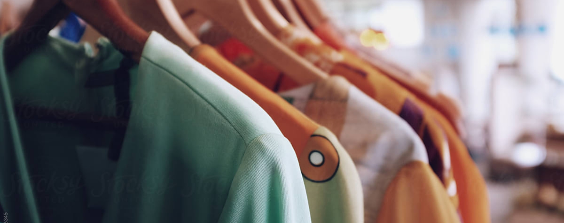 Goodwill AZ | Different color clothing hanging on hangers