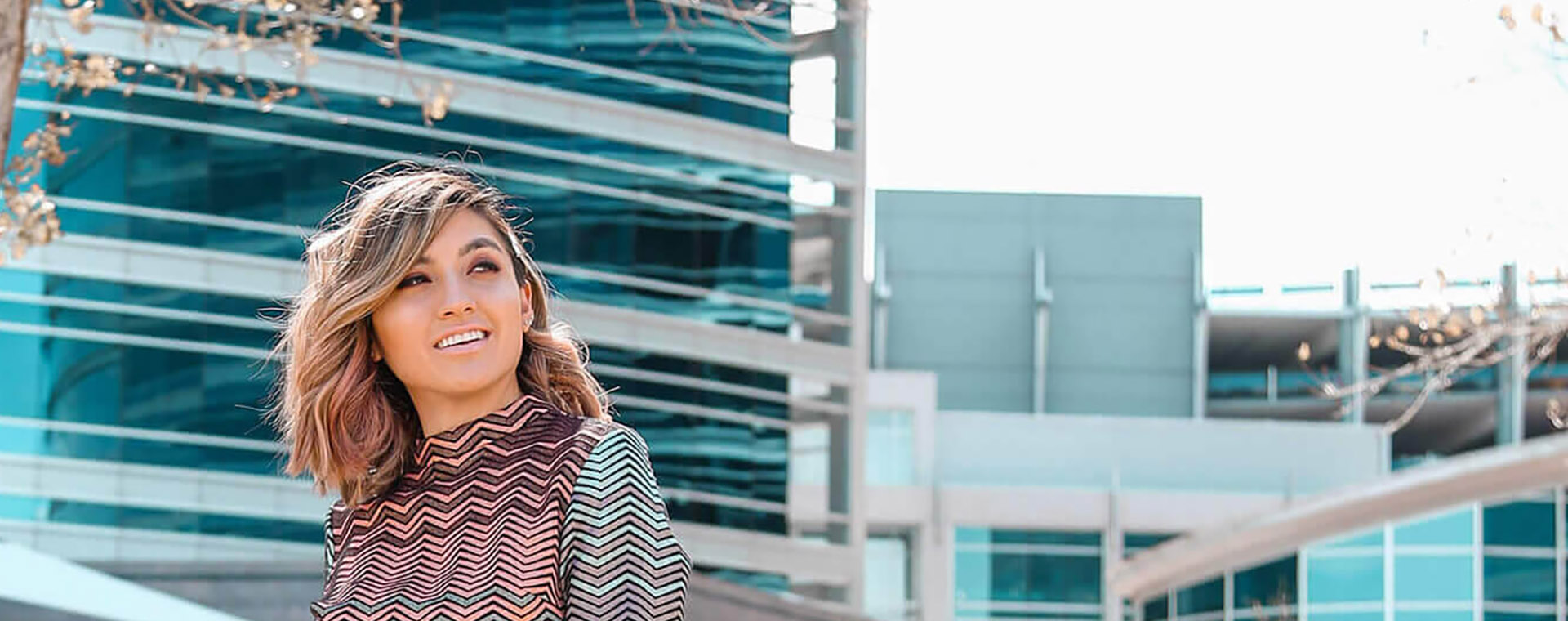 Goodwill AZ | Women smiling outside tall buildings