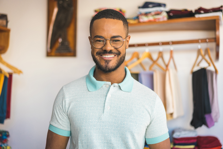 man smiling wearing a polo shirt