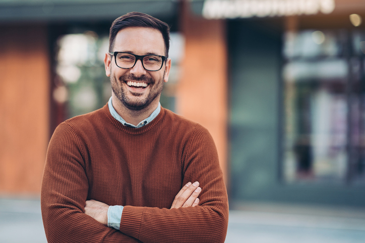 smiling man wearing casual sweater