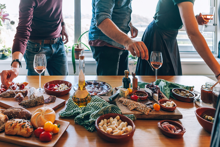 finger food at the table party - people enjoy appetizer and tapas