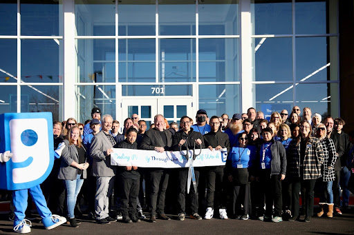 Group of people outside the Flagstaff Goodwill Grand Opening