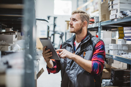 Man taking stock of merchandise