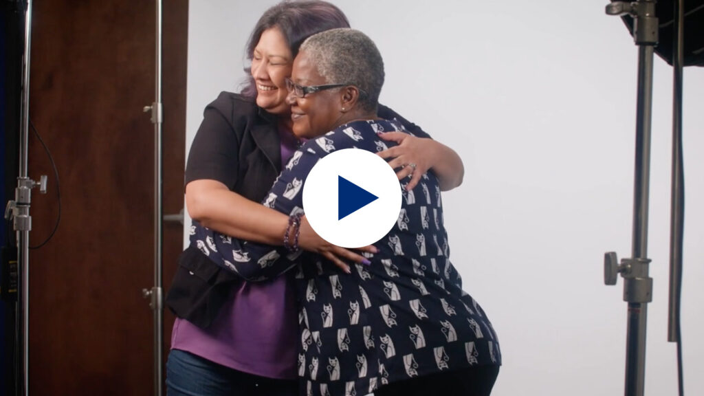 video thumbnail of two women hugging