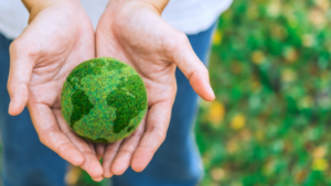 Someone holding their hands together holding a green ball