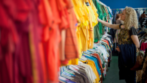 A women looking at racks of clothing