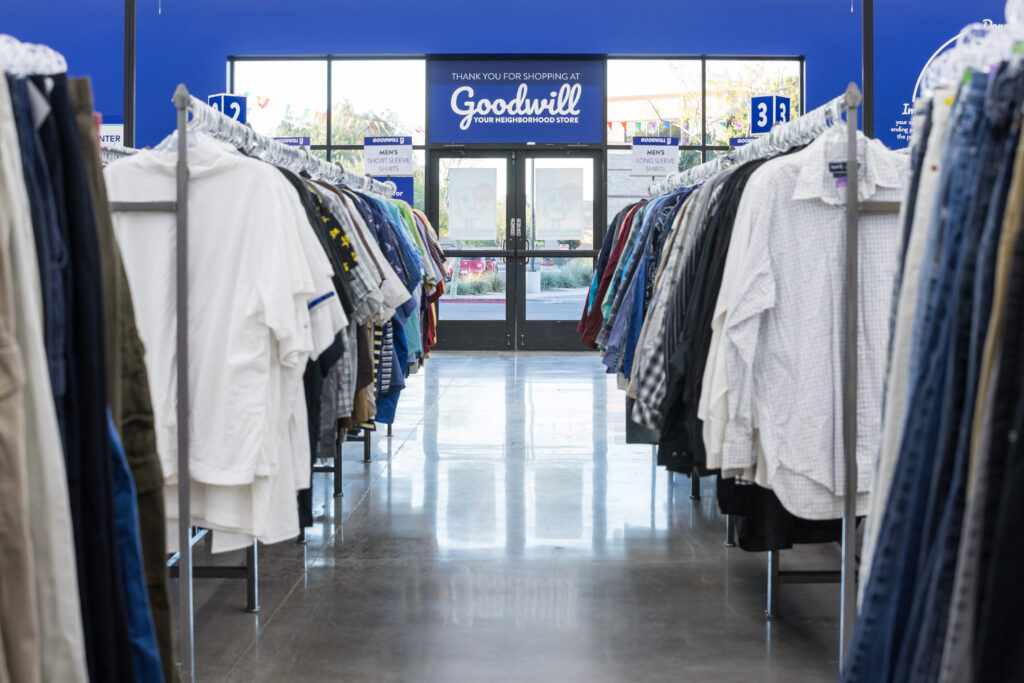 Interior of a Goodwill store and the aisle of clothing