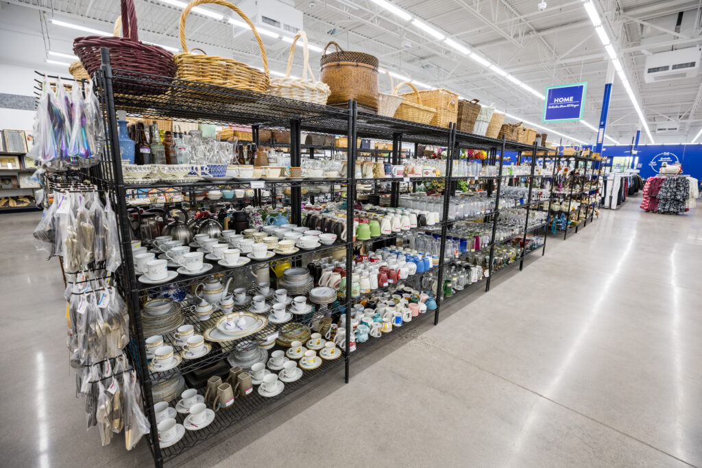 Inside a Goodwill store, aisles of products