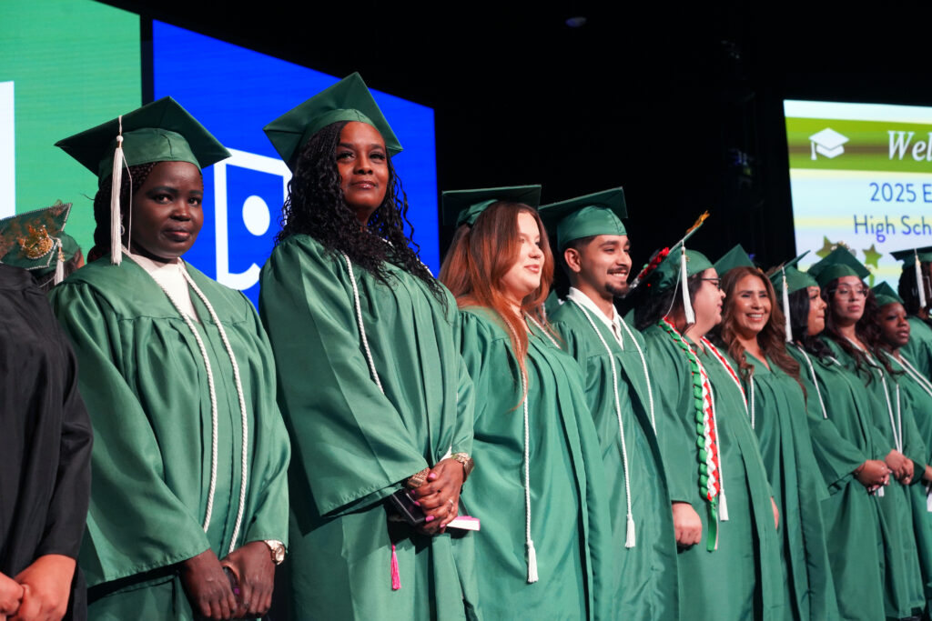 a group of Excel Center Graduate on a stage