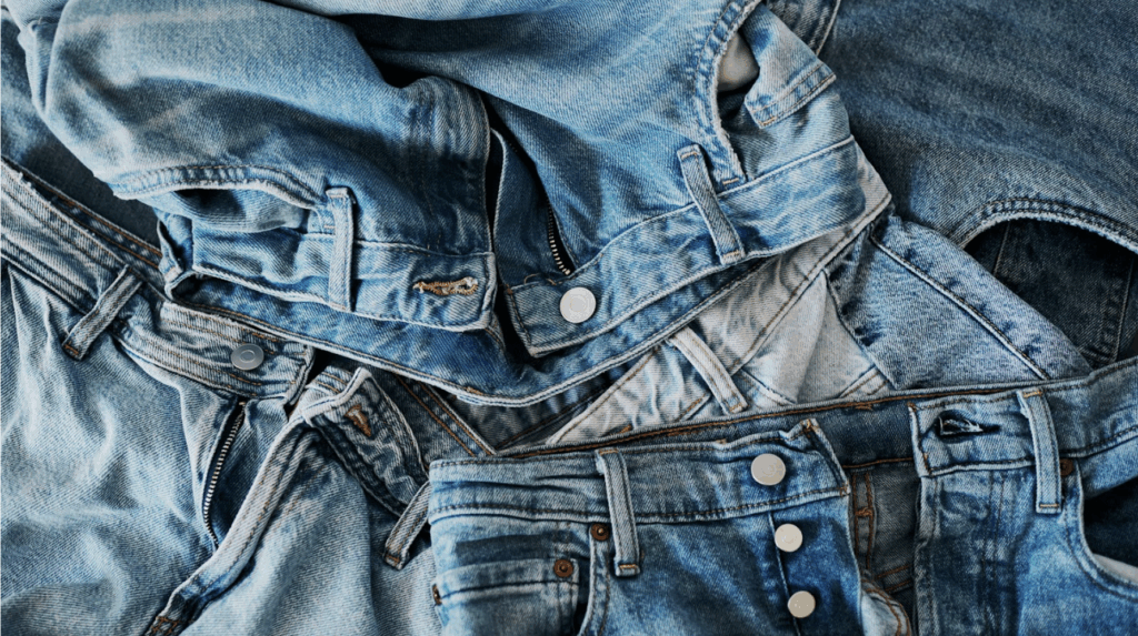 Multiple jeans in a pile