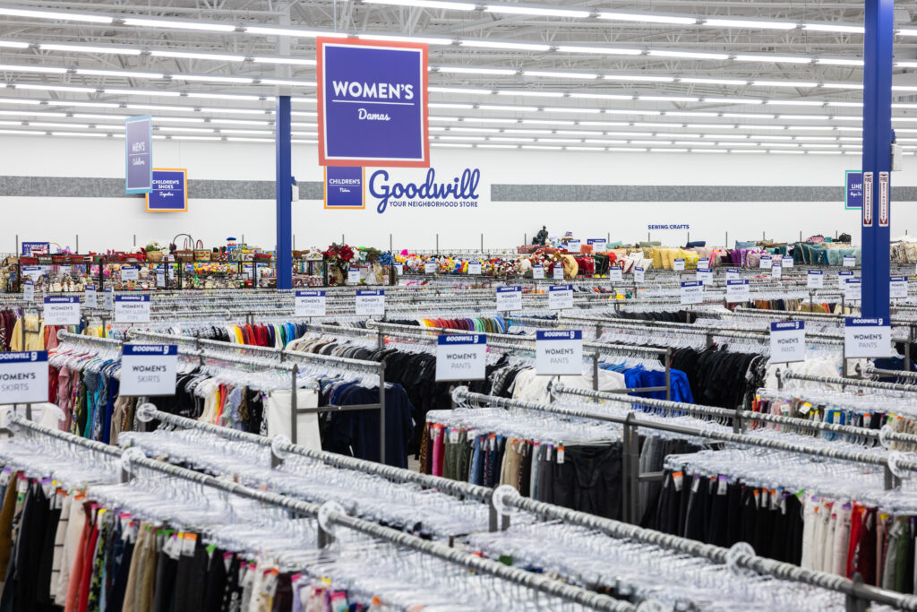 Interior of a Goodwill building with aisles of clothing and items