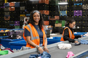 A team member sorts clothing at the Goodwill Retail Operations Center