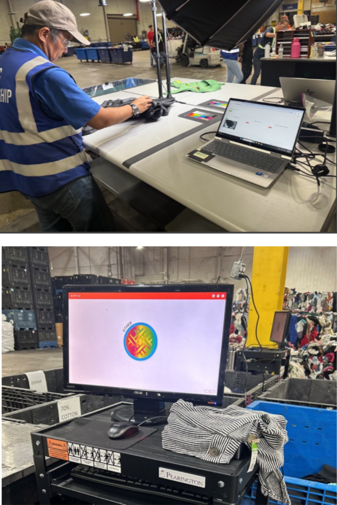 A man in the Goodwill warehouse taking images of clothing and a computer