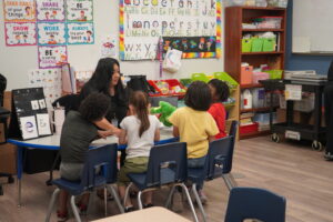 Spark staff member and students sitting together