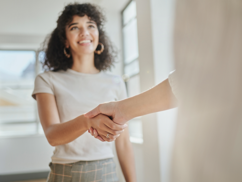 A women shaking hands with someone